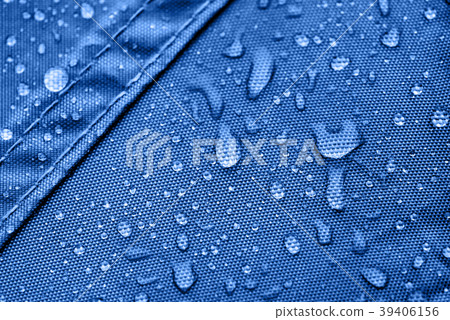 Blue rainproof tent sheet with morning rain drops 39406156