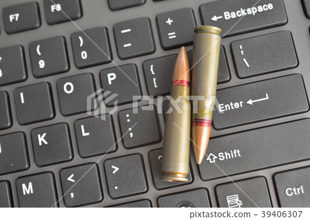 Internet dangers concept. Close up of bullets 39406307