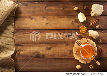 glass jar of honey on wood glass jar of honey on wood 39407760