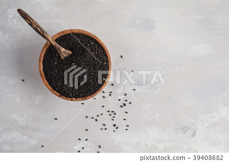 Nigella sativa or Black cumin in wooden bowl Nigella sativa or Black cumin in wooden bowl 39408682