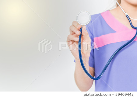 Hand of medical doctor and stethoscope. Hand of medical doctor and stethoscope. 39409442