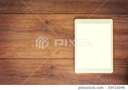 Blank Tablet computer on wood table background 39410046