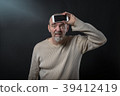 old man does not understand his smartphone 39412419