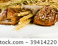 white bread with spikelets of wheat, oats and rye 39414220