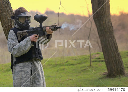 Paintball player under attack in forest Paintball player under attack in forest 39414478