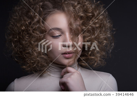 Portrait of a beautiful teenage girl with a creative make-up. Portrait of a beautiful teenage girl with a creative make-up. 39414646