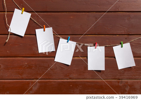 Five white sheets for notes on the wooden wall Five white sheets for notes on the wooden wall 39416969