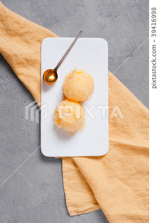 Two balls of  lemon sorbet in the white plate 39416998