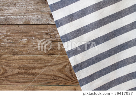 Striped napkin on the wooden background Striped napkin on the wooden background 39417057