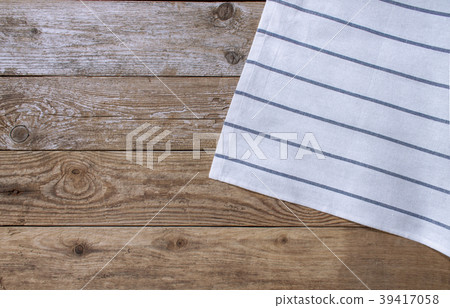 Striped napkin on the wooden background Striped napkin on the wooden background 39417058