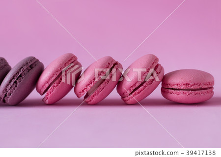 Pink and purple macaroons on pink 39417138
