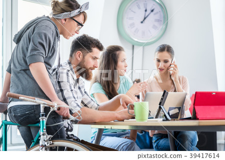 Self-employed young man analyzing a difficult task 39417614