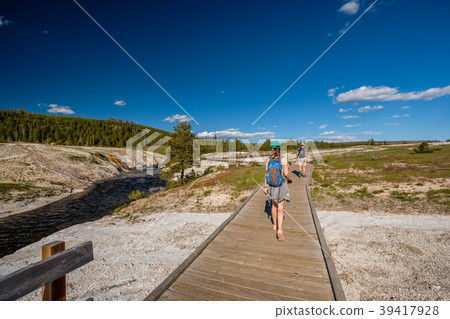 Tourists with backpack hiking in Yellowstone 39417928