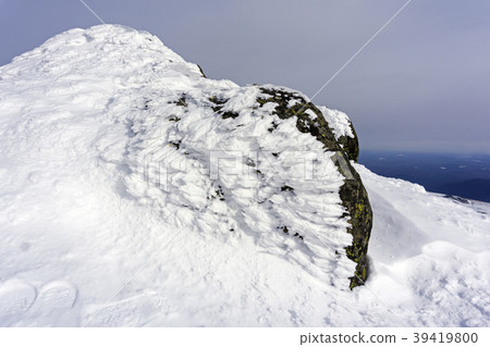 granite stone, covered with bizarre ice outgrowths granite stone, covered with bizarre ice outgrowths 39419800