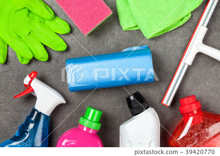 Cleaning supplies on grey background 39420770