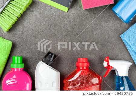 Cleaning supplies on grey background 39420786