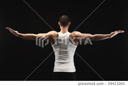 Unrecognizable man shows strong back muscles Unrecognizable man shows strong back muscles 39421002
