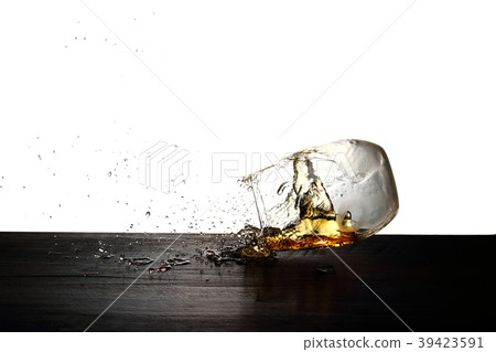 Whiskey jumping out of a glass 39423591