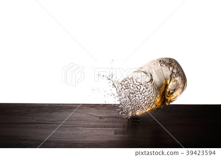 Whiskey jumping out of a glass 39423594
