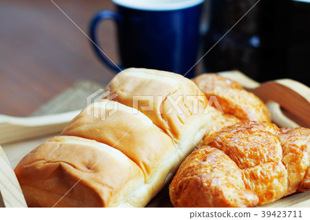 Bread on wooden table. 39423711