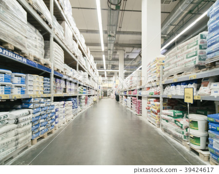 Blurred aisle with finishing materials in hardware Blurred aisle with finishing materials in hardware 39424617