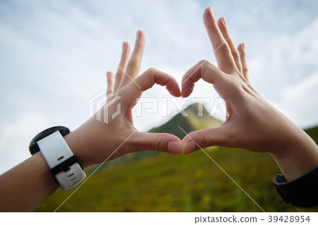 Image of heart from palms against background of Image of heart from palms against background of 39428954