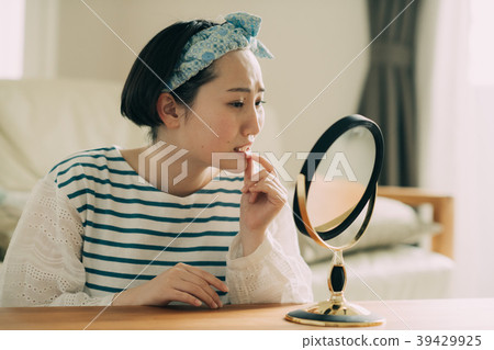 Young woman who cares about rough lips Young woman who cares about rough lips 39429925