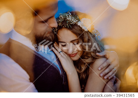 Beautiful bride and groom on a meadow at night. Beautiful bride and groom on a meadow at night. 39431565