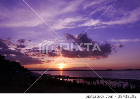 A fantastic lake illuminated by purple in the evening sun (Cambodia) 39432192