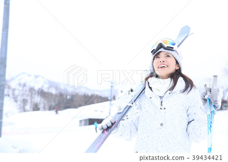 Young female skier 39434421