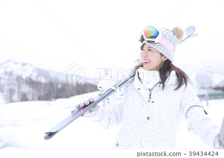 Young female skier 39434424