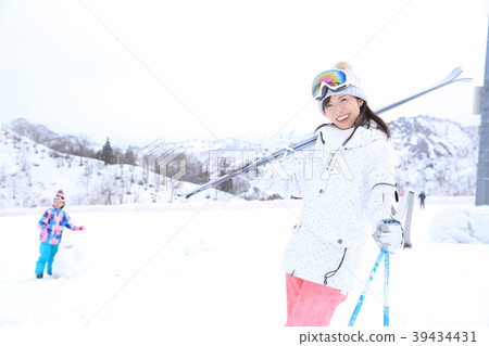 Young female skier 39434431