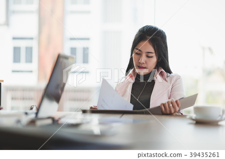 Asian executive female managing papework 39435261