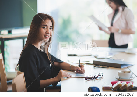 Asian executive female managing papework Asian executive female managing papework 39435268