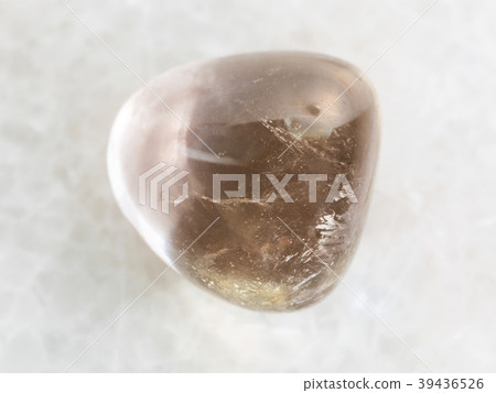 polished smoky quartz gem stone on white marble 39436526