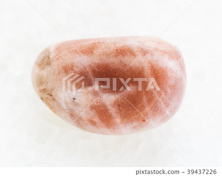 polished moonstone gemstone on white marble 39437226
