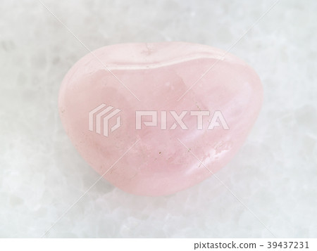 polished Rose Quartz gem stone on white marble polished Rose Quartz gem stone on white marble 39437231