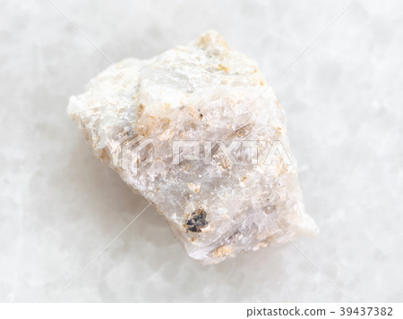 raw Conglomerate stone on white marble 39437382
