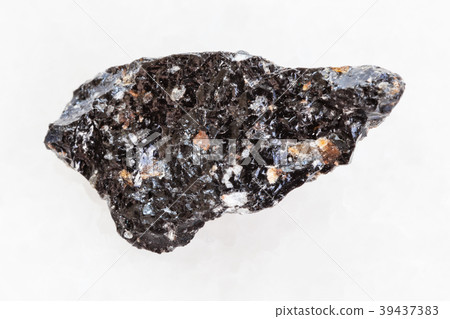 raw obsidian (volcanic glass) stone on white 39437383