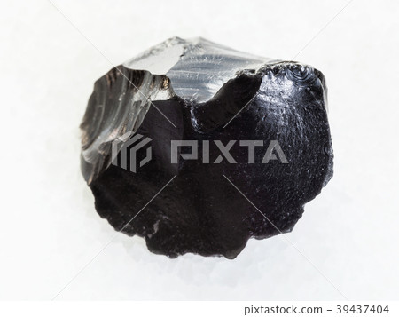 raw obsidian (volcanic glass) crystal on white raw obsidian (volcanic glass) crystal on white 39437404