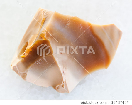 rough brown Flint stone on white marble 39437405
