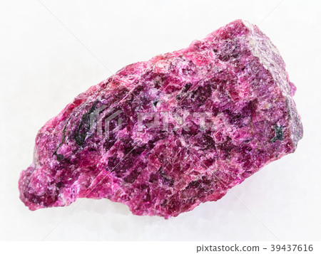 raw Eudialyte stone on white marble raw Eudialyte stone on white marble 39437616