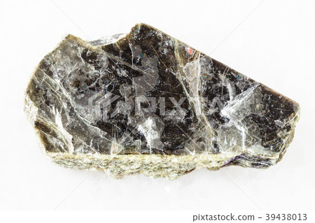 rough muscovite mica stone on white marble 39438013