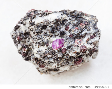 raw corundum crystals in gneiss stone on white 39438027