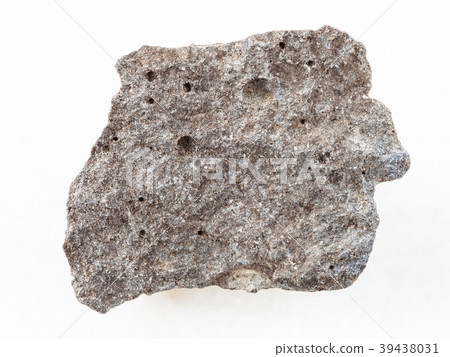 piece of gray basalt stone on white marble 39438031