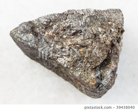 raw Arsenopyrite stone on white marble raw Arsenopyrite stone on white marble 39438040