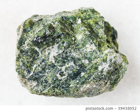 rough serpentine stone on white marble 39438052