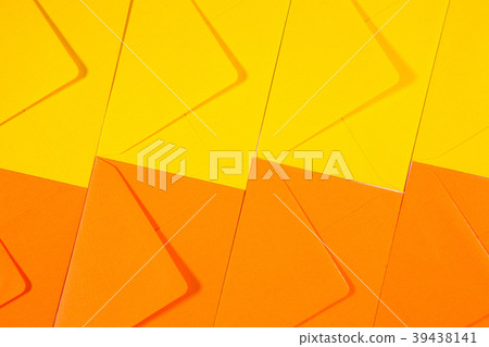 Orange and yellow envelopes on the table Orange and yellow envelopes on the table 39438141