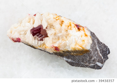 crystal of Cinnabar in raw Carbonatite stone 39438357