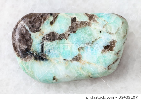 polished Pegmatite stone on white 39439107